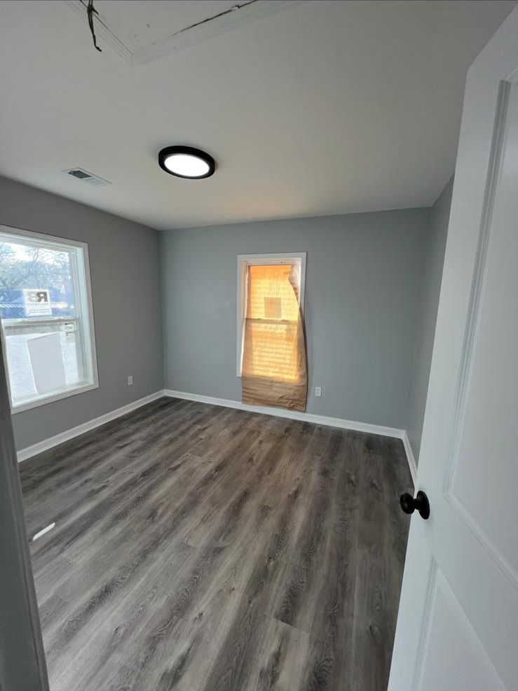 Bedroom with new vinyl plank floor